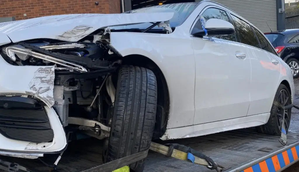 Accident damage to a vehicle loaded on a recovery truck