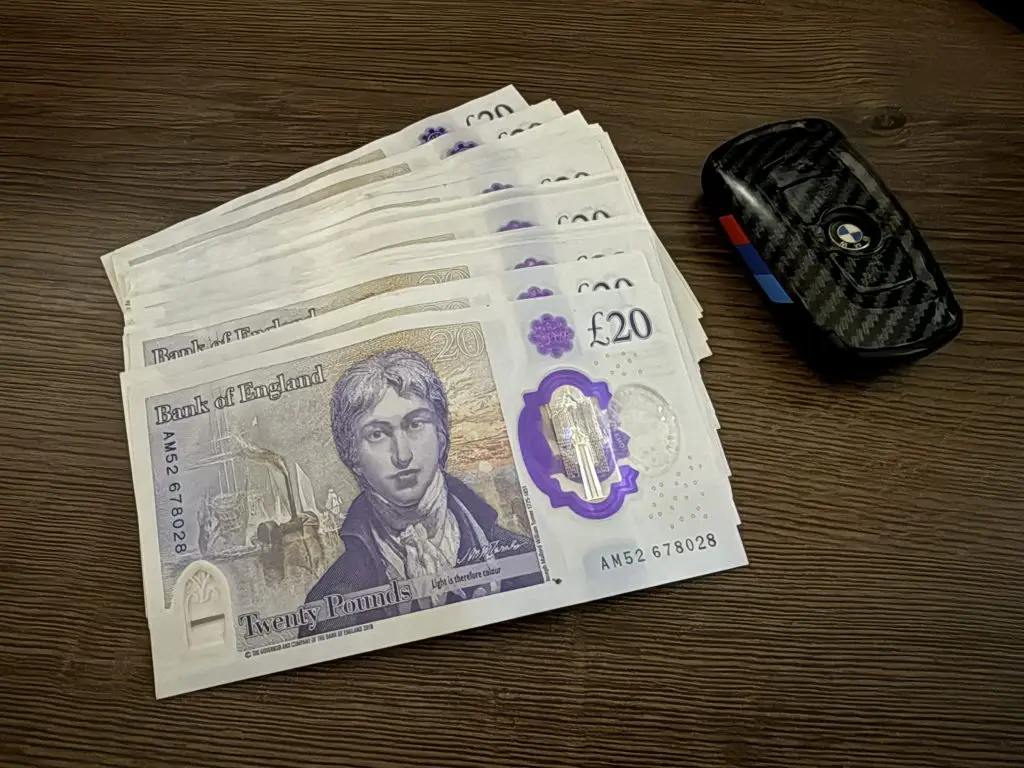 Cash next to a car key